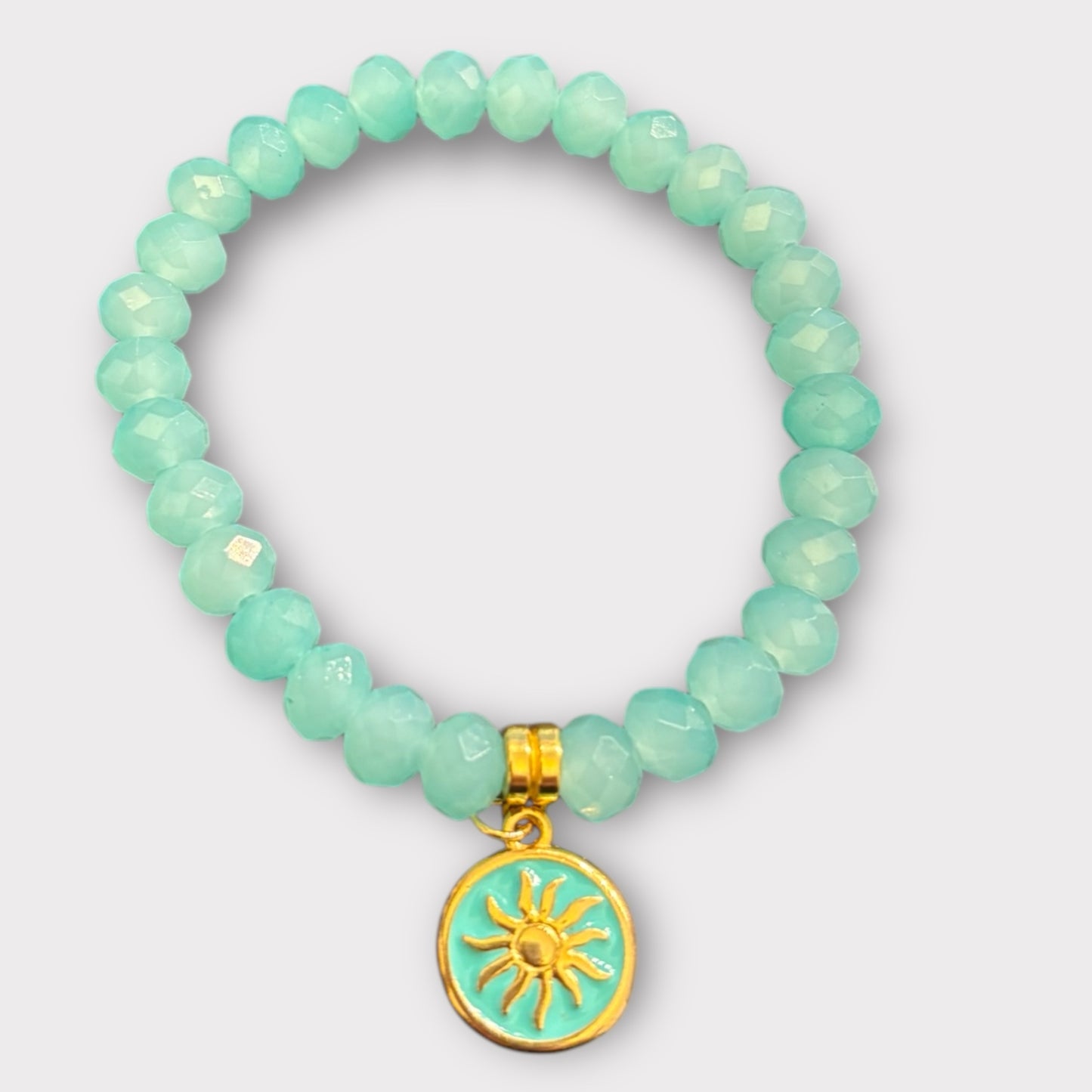 Perlenarmband in türkis mit Sonnenanhänger