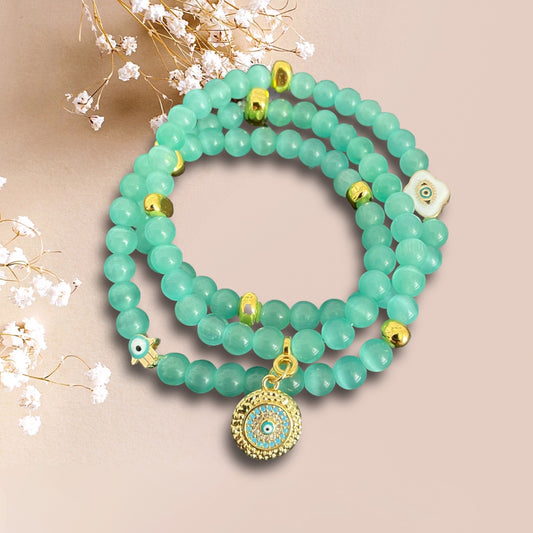 Armband MIRIKIT aus Cateye Perlen in hellgrün mit einem Anhänger Mandala