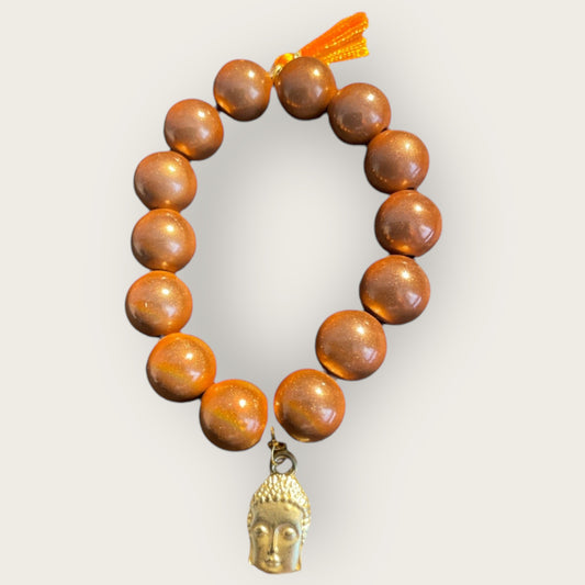 Armband aus braunen Miracle Perlen mit einem Buddha Anhänger