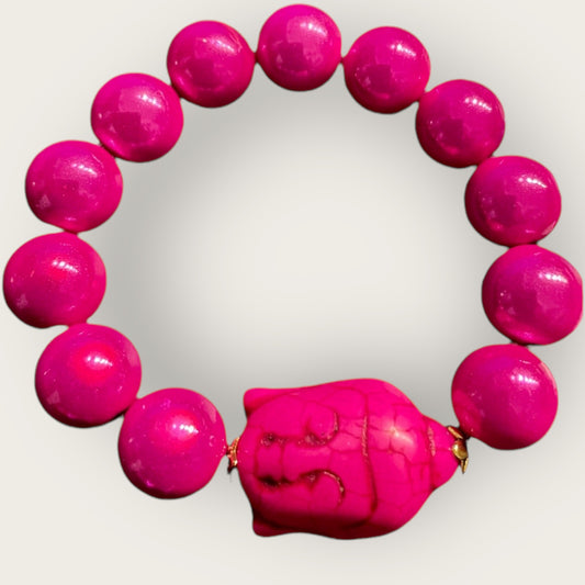 Armband aus Miracle Perlen in pink mit einer Perle Buddha