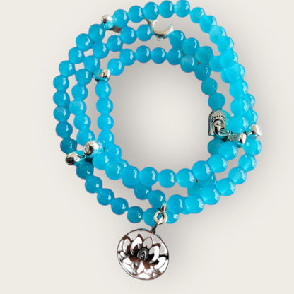 Armband türkis aus Cateye Perlen mit einer Buddha Perle und einem Anhänger Lotusblume