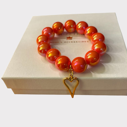 Armband DEEP ORANGE aus großen leuchtenden Perlen in orange mit Herzanhänger