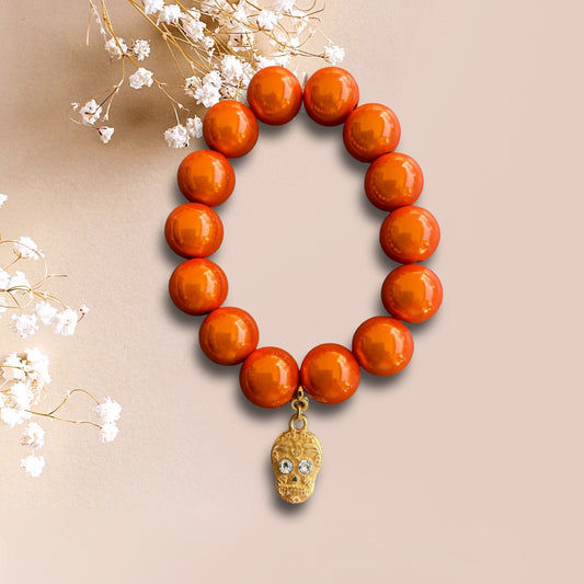 Armband LOVELY SKULL aus leuchtenden Miracle Perlen in orange mit einem Anhänger Skull der Marke SchauTime