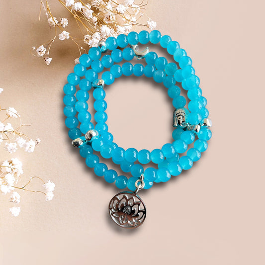 Armband ELBA aus Cateye Perlen in türkis mit einer Buddha Perle und einem Anhänger Lotusblume