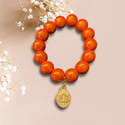 Armband GAN aus Miracle Perlen in orange mit eine Anhänger Lotusblume der Marke SchauTime