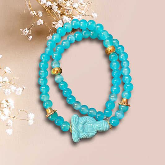 Armband NAXOS aus Perlen in türkis mit einer Buddha Perle