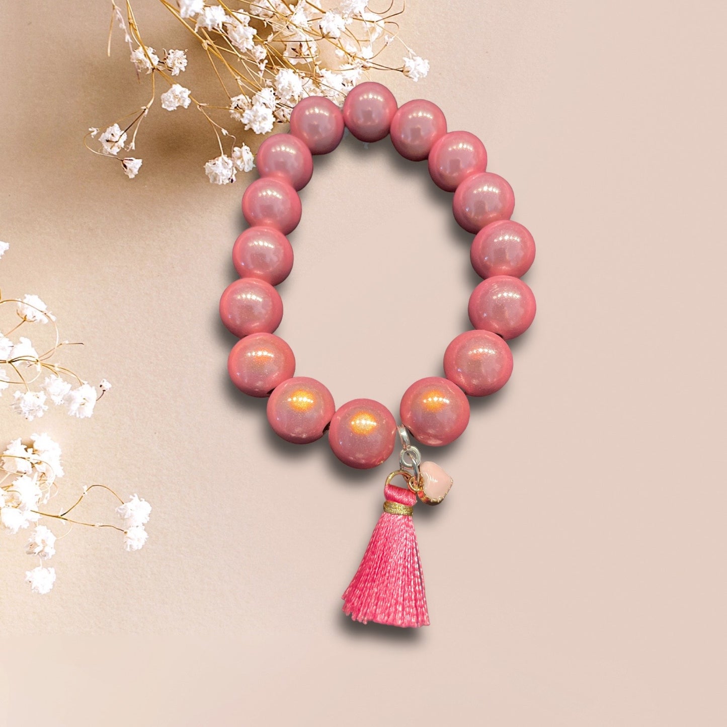 Armband ROSA LOVE aus Miracle Perlen in rosa sowie einer Quaste und Herzanhänger