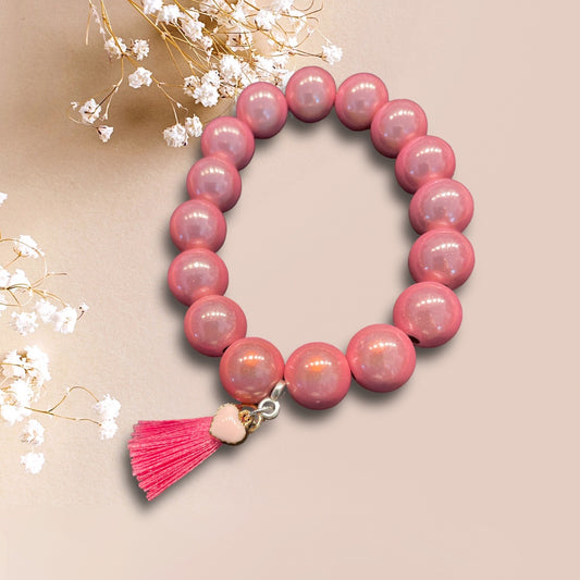 Armband ROSA LOVE aus Miracle Perlen in rosa sowie einer Quaste und Herzanhänger