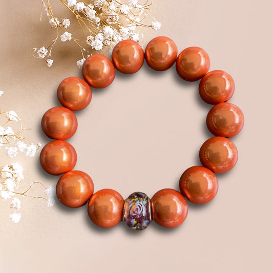 Armband LARISSA aus leuchtenden Miracle Perlen  in der Farbe Orange mit einer Glasperle