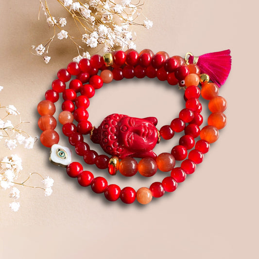 Armband LARA aus roten Perlen mit einer großen Buddha Perle
