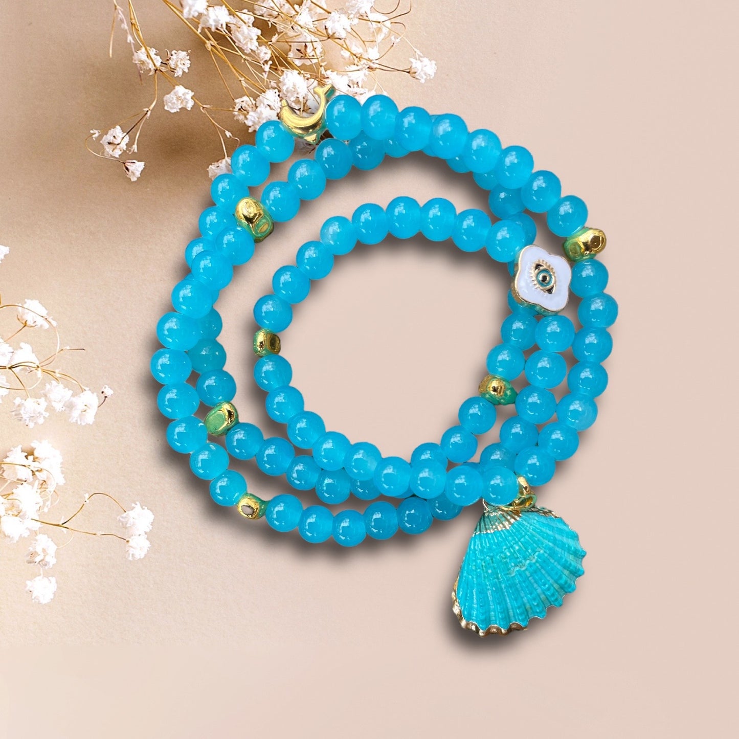Armband BLUE SHELL aus Perlen in türkis mit einem Anhänger Muschel